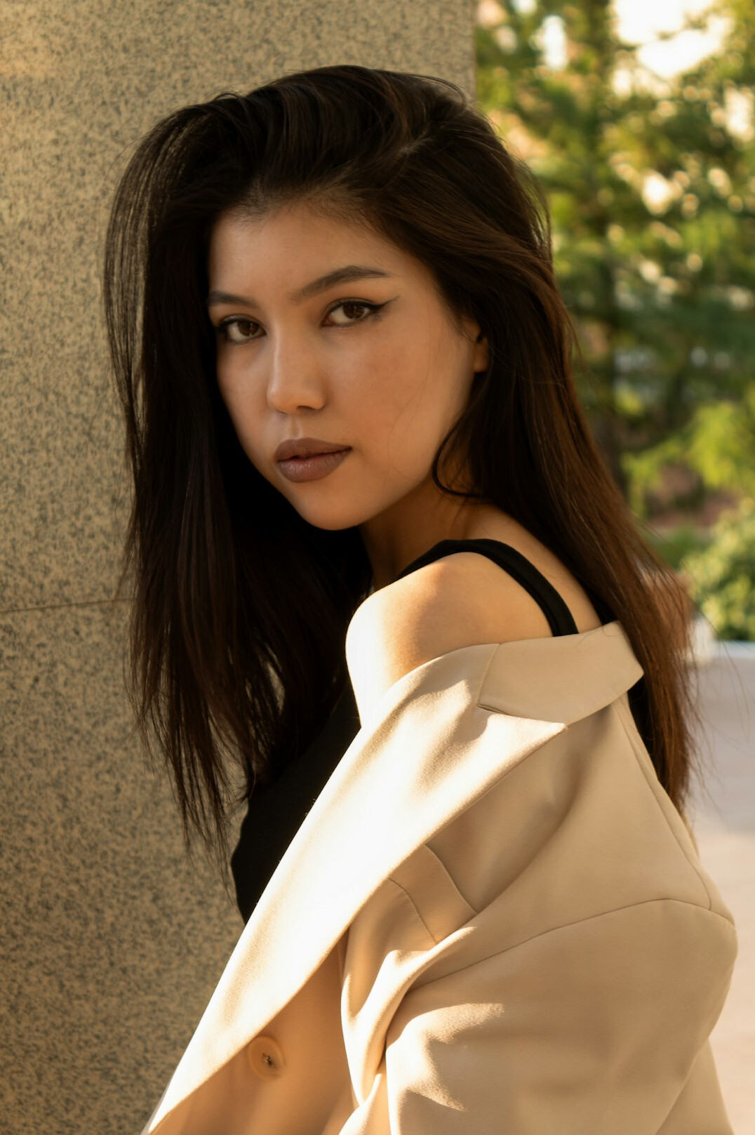 Portrait of a professional woman with dark hair in a blazer