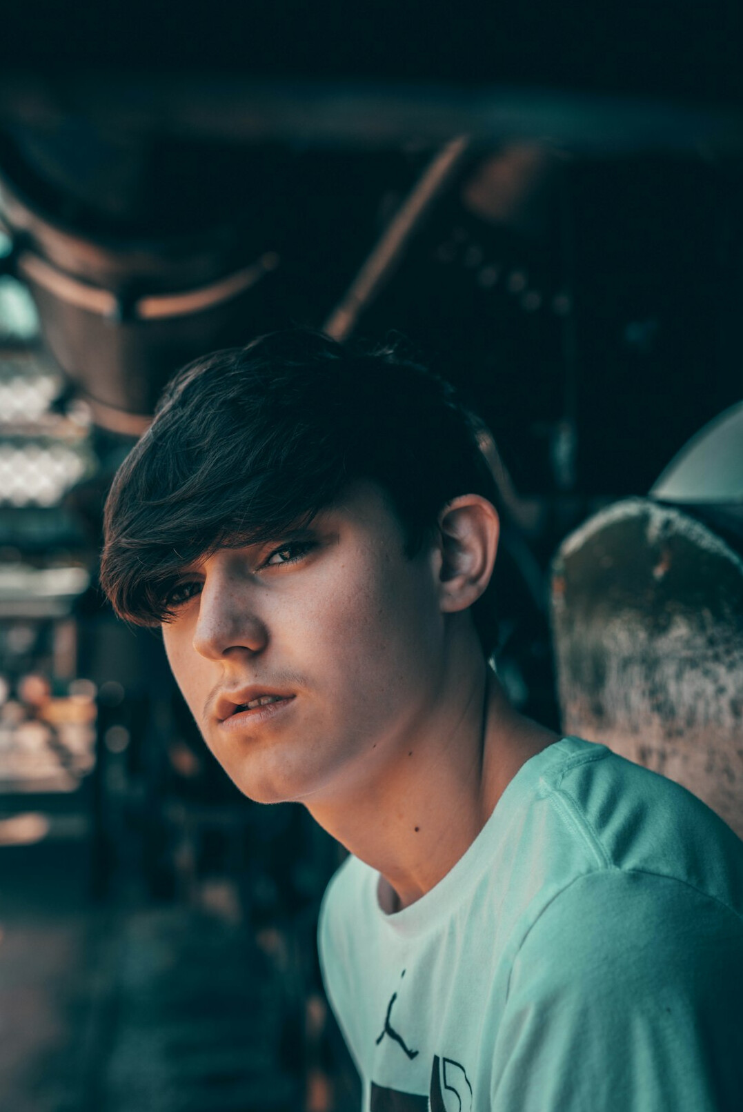 Portrait of a young man in a light shirt looking at the camera